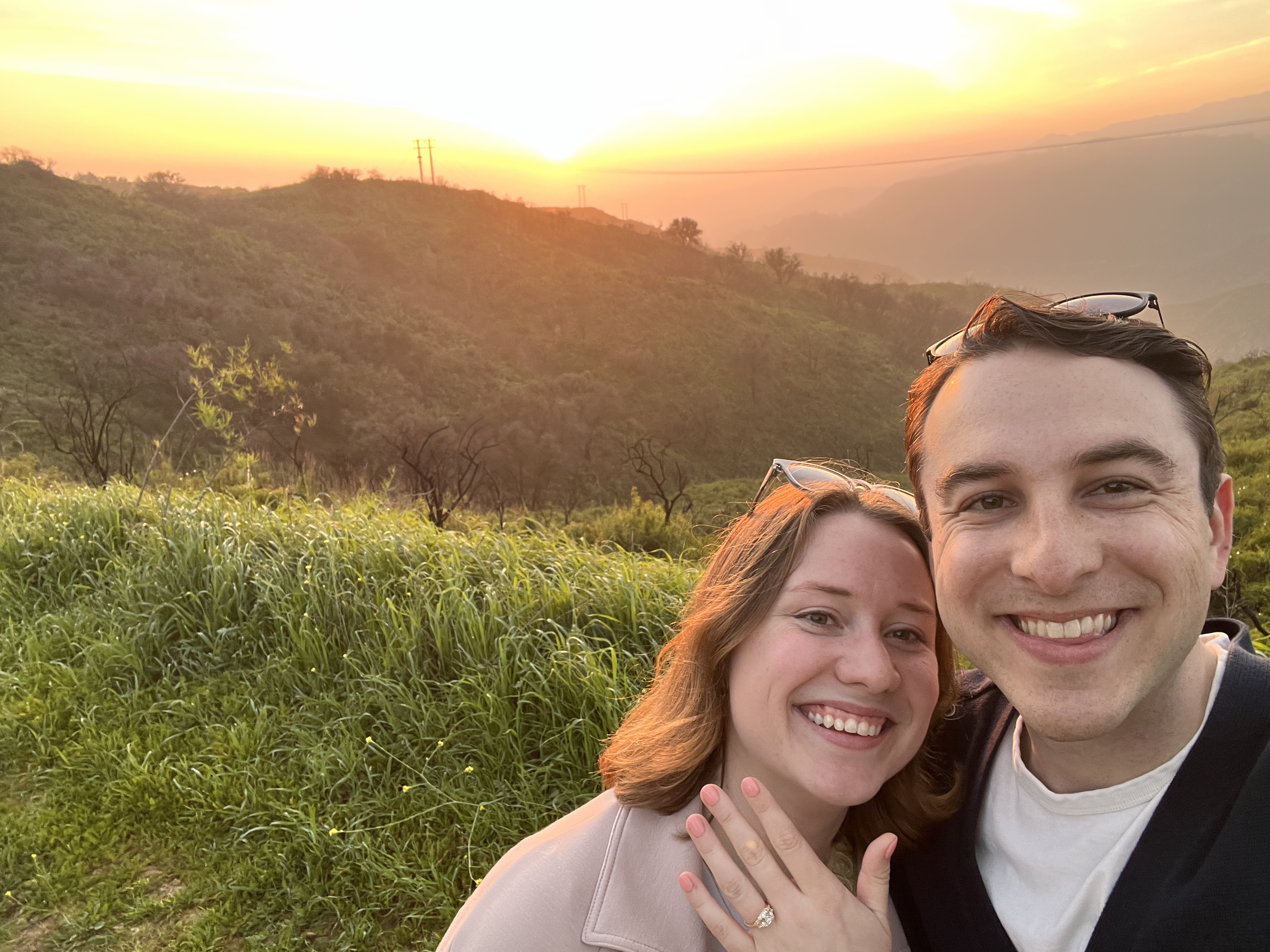 Baillie and William cheek to cheek at sunset